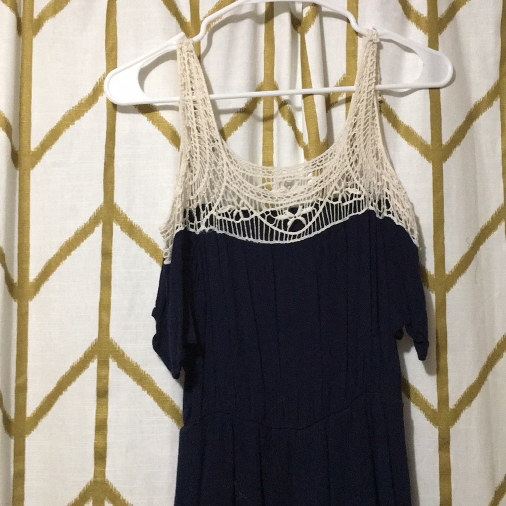 Short navy dress with lace details on the top